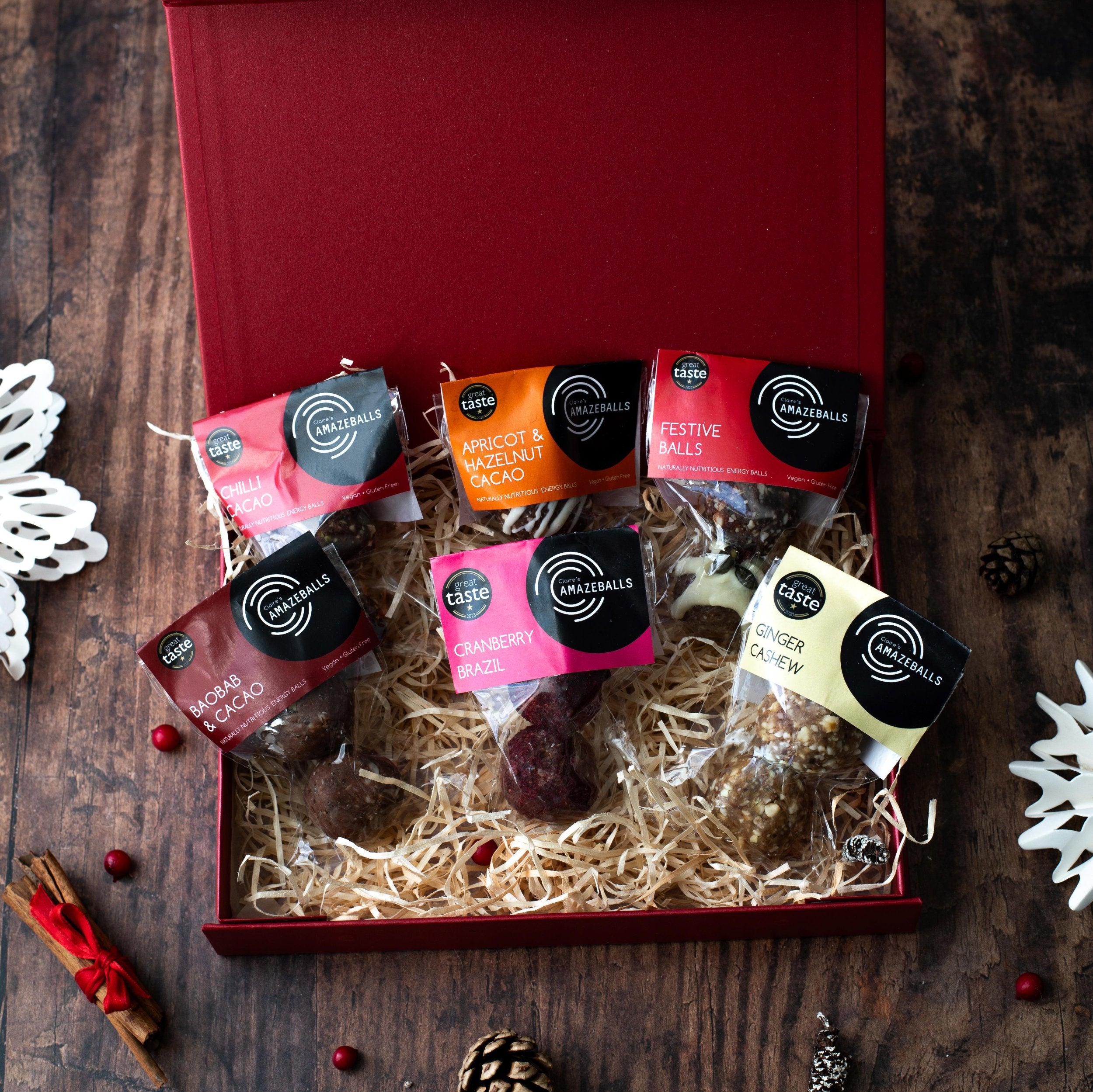 Festive box showcasing 6 packs of 2 Claire's Amazeballs energy balls