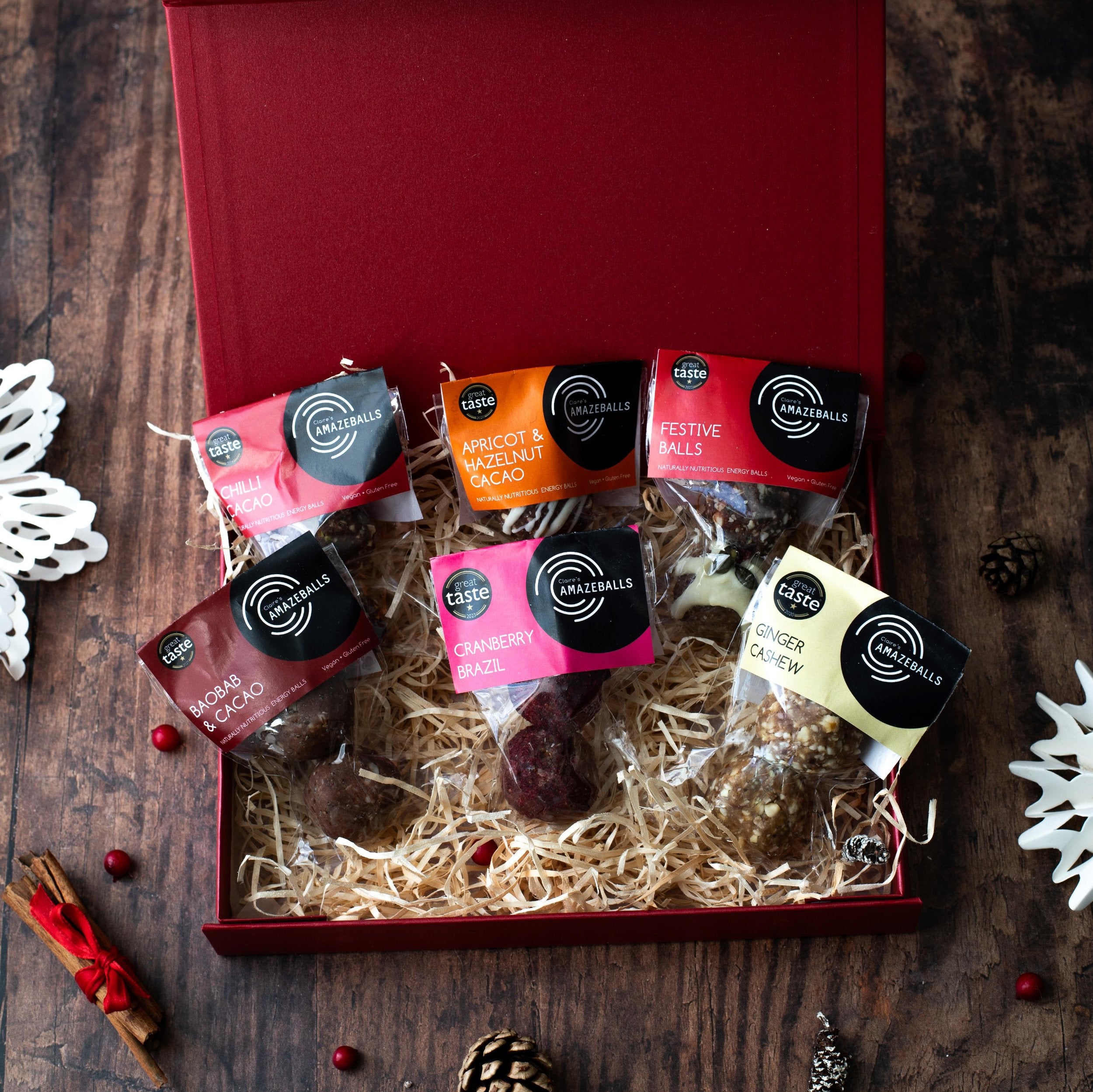 Festive box showcasing 6 packs of 2 Claire's Amazeballs energy balls 