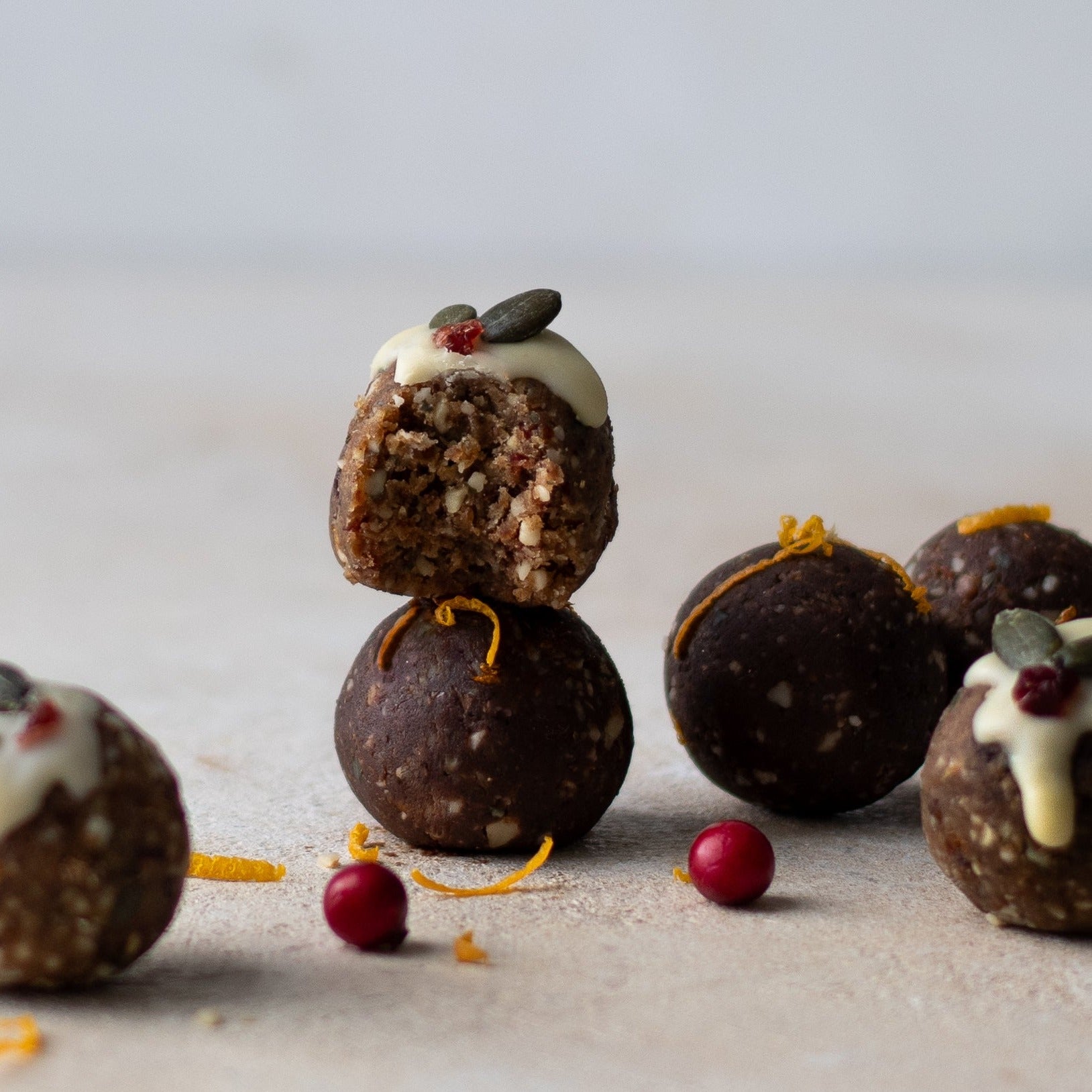 A small selection of festive energy balls with fresh cranberries
