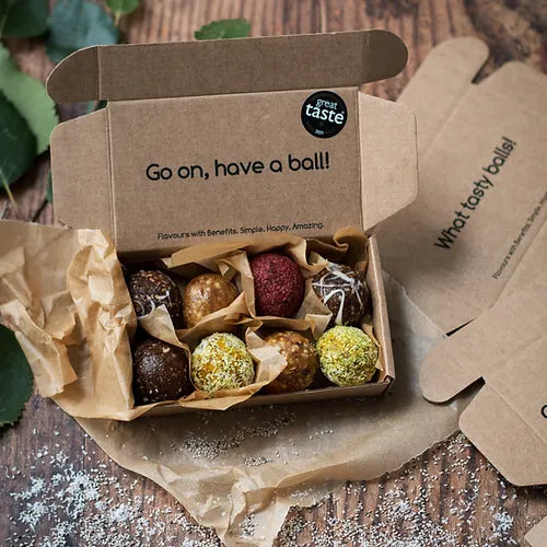 A mix box of energy balls with the slogan go on, have a ball! 